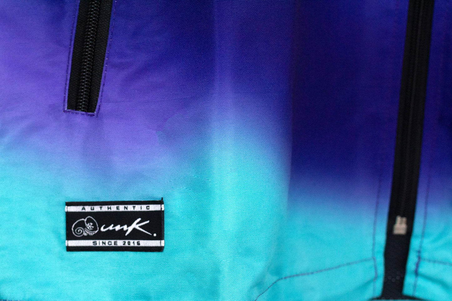 Jacket Cortaviento Unk. Rainbow Blue